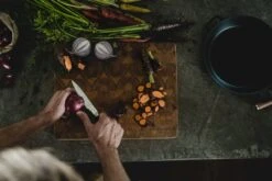 Fiskars Norden Paring Knife 12 Fiskars Norden Paring Knife -Kitchenware Store Fiskars Norden Paring knife cutting onion Hero image 1026424